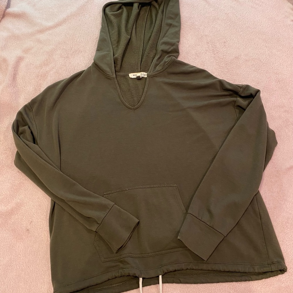 Olive green hoodie with pocket and string at bottom to cinch waist.